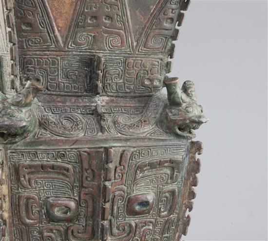 A rare Chinese archaic bronze ritual wine vessel, Fangzun, Shang dynasty, 13th-11th century B.C., 33.5cm high, losses and repairs